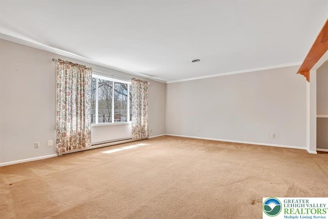 empty room with carpet, baseboard heating, baseboards, and ornamental molding