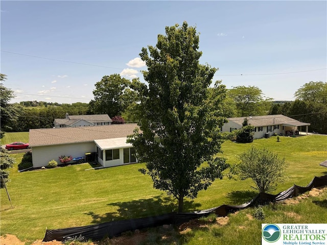 5743 Crescent Dr, North Whitehall Twp, PA 18078 - view of front of house featuring a front lawn and a sunroom