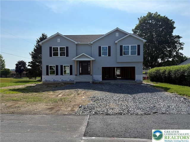 5743 Crescent Dr, North Whitehall Twp, PA 18078 - traditional-style house featuring gravel driveway and a garage