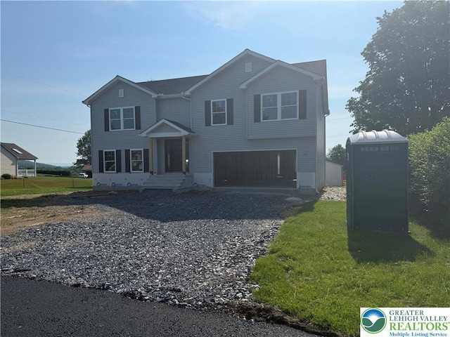 5743 Crescent Dr, North Whitehall Twp, PA 18078 - traditional-style home with a garage and gravel driveway