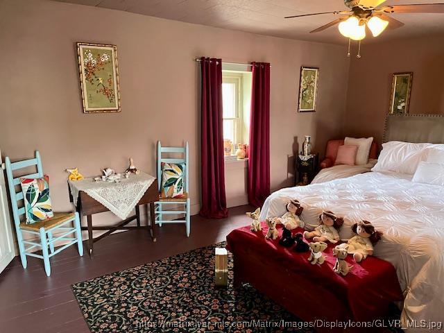 bedroom with wood finished floors
