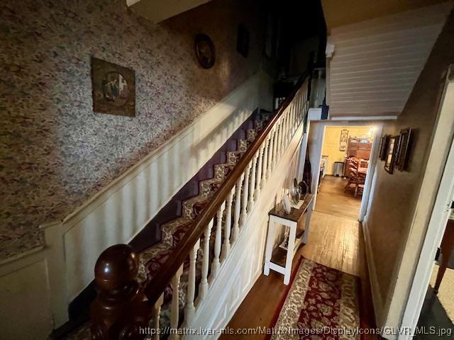 stairs with wood finished floors