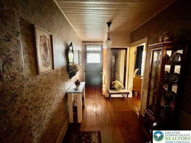 hall featuring dark wood-style flooring