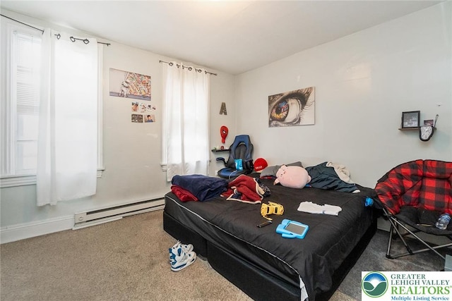 bedroom featuring a baseboard heating unit and carpet floors