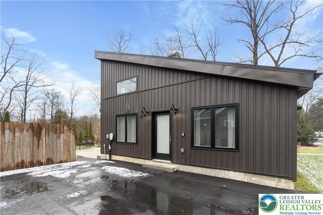 5112 Creek Rd, Heidelberg Twp, PA 18078 - view of front of home with board and batten siding and fence