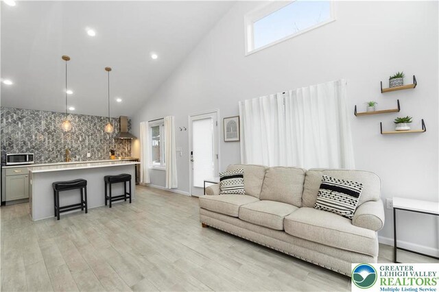5112 Creek Rd, Heidelberg Twp, PA 18078 - living area with light wood-style flooring, high vaulted ceiling, and recessed lighting