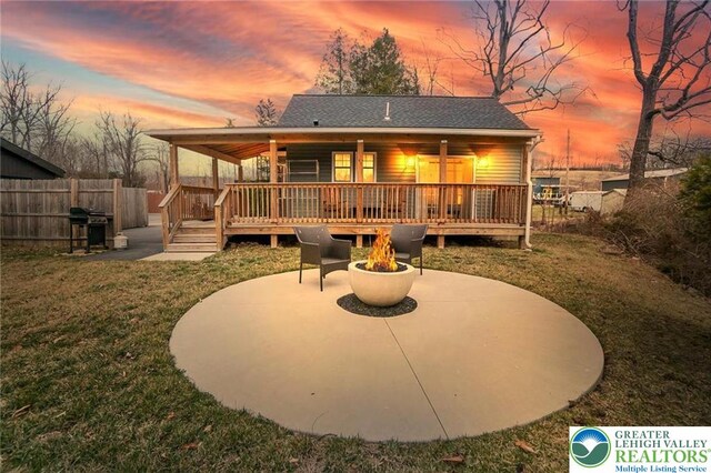 5112 Creek Rd, Heidelberg Twp, PA 18078 - back of property featuring a yard, a deck, fence, and an outdoor fire pit