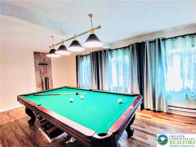 game room with billiards, a baseboard heating unit, and wood finished floors