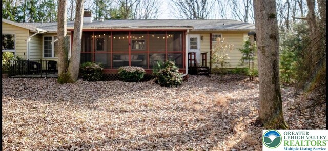 71 Dogwood Dr, Penn Forest Twp, PA 18229 - back of house with a sunroom and a chimney