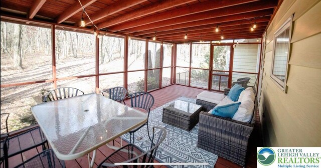 71 Dogwood Dr, Penn Forest Twp, PA 18229 - sunroom with outdoor dining space and beam ceiling
