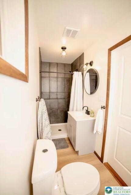 71 Dogwood Dr, Penn Forest Township, PA 18229 - full bath with toilet, a stall shower, vanity, and visible vents