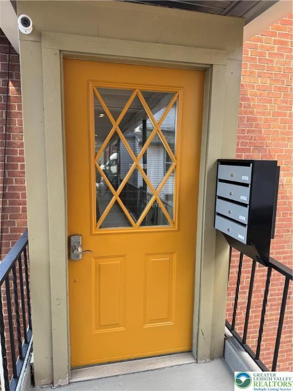 entrance to property with brick siding