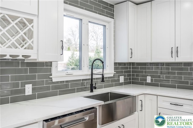 525 N Main St, Allentown City, PA 18104 - kitchen featuring stainless steel dishwasher, a sink, white cabinetry, and healthy amount of natural light