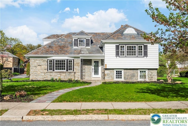 525 N Main St, Allentown City, PA 18104 - view of front of house with a high end roof, a front lawn, and stone siding