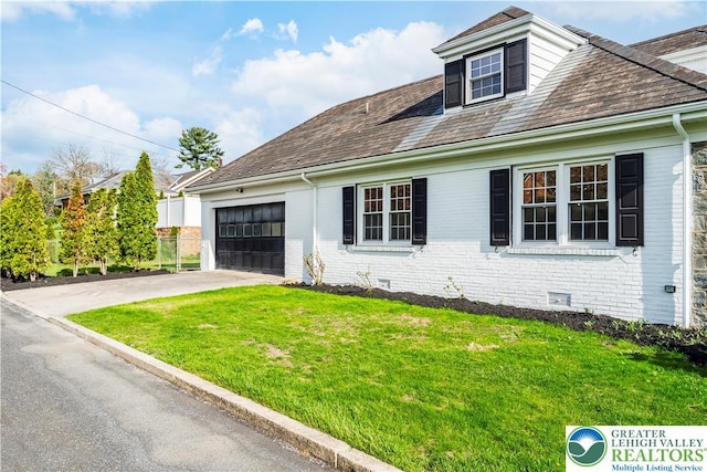 525 N Main St, Allentown City, PA 18104 - view of front of house featuring driveway, a garage, a front lawn, and brick siding