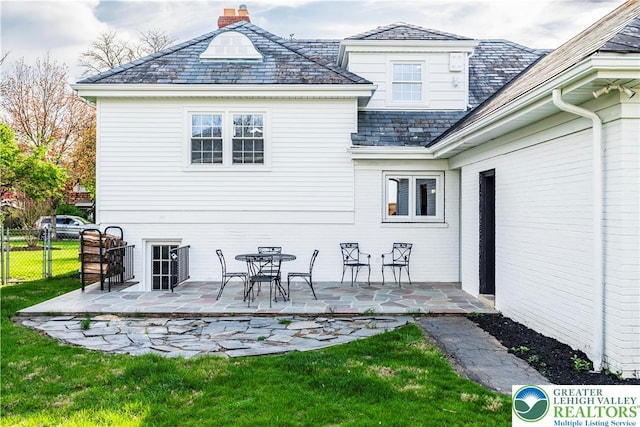 525 N Main St, Allentown City, PA 18104 - back of house with a high end roof, a chimney, and a patio