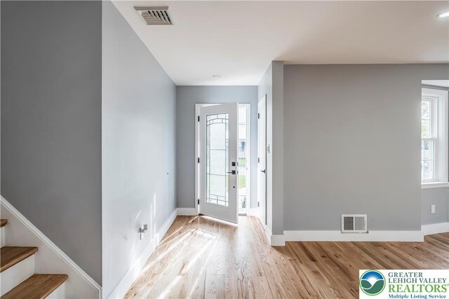 525 N Main St, Allentown City, PA 18104 - entryway featuring wood finished floors, baseboards, and stairway