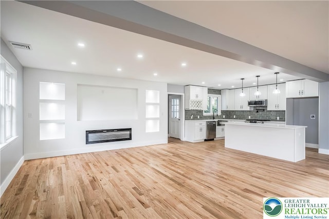 525 N Main St, Allentown City, PA 18104 - kitchen with stainless steel appliances, white cabinets, light countertops, light wood-style flooring, and recessed lighting