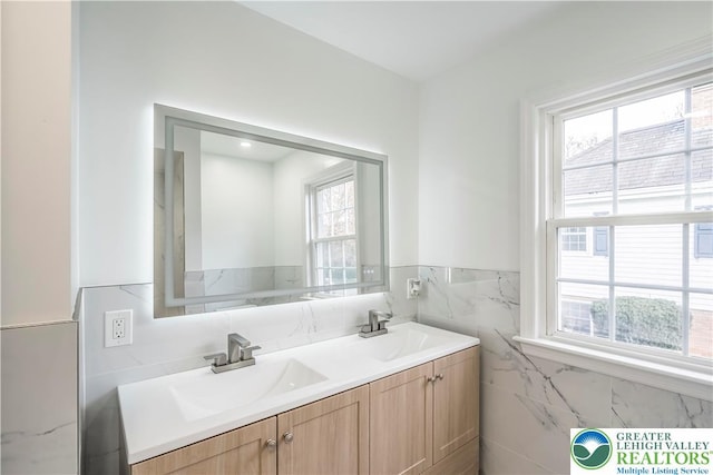 525 N Main St, Allentown City, PA 18104 - full bathroom with double vanity, tile walls, and wainscoting