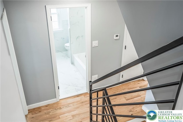 525 N Main St, Allentown City, PA 18104 - staircase with wood finished floors and baseboards