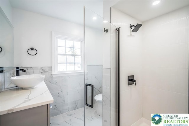 525 N Main St, Allentown City, PA 18104 - full bath with tile walls, a marble finish shower, marble tiled flooring, vanity, and recessed lighting