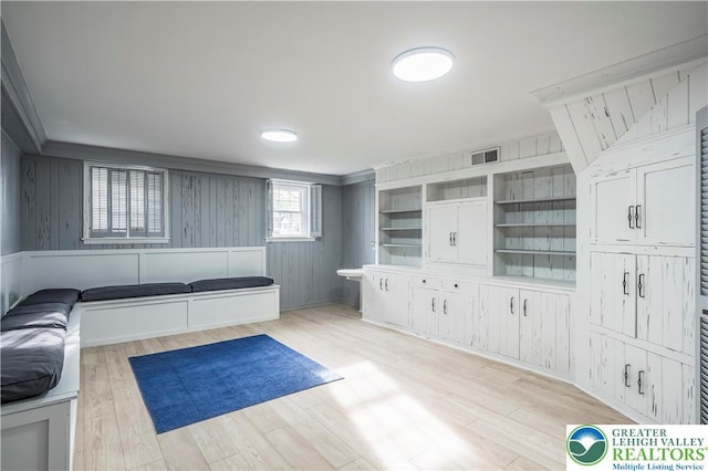 525 N Main St, Allentown City, PA 18104 - unfurnished living room featuring light wood-type flooring and wooden walls