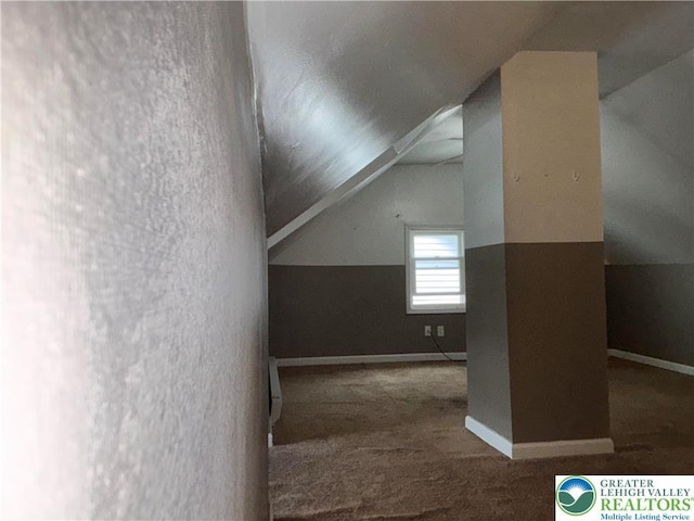 bonus room with lofted ceiling, baseboards, and carpet floors