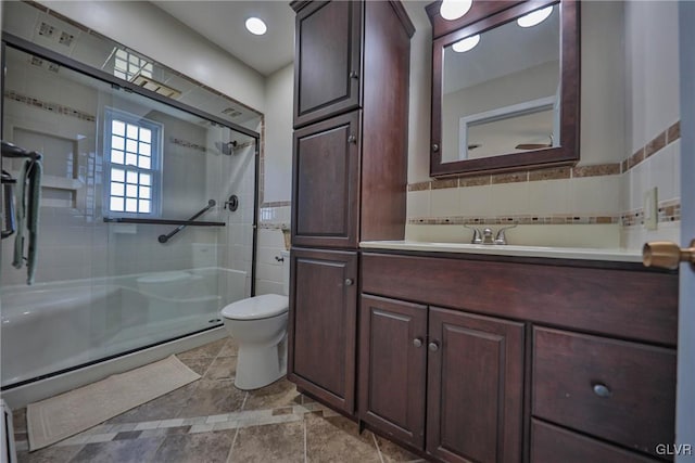 3332 Sherwood Rd, Palmer Twp, PA 18045 - bathroom featuring tile walls, vanity, a shower stall, and toilet