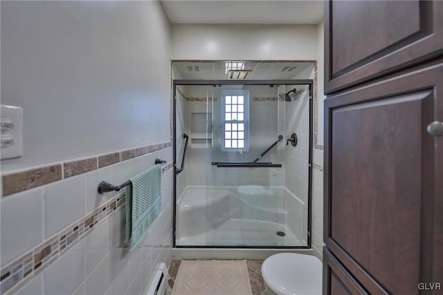 3332 Sherwood Rd, Palmer Twp, PA 18045 - bathroom featuring a shower stall, toilet, and tile walls