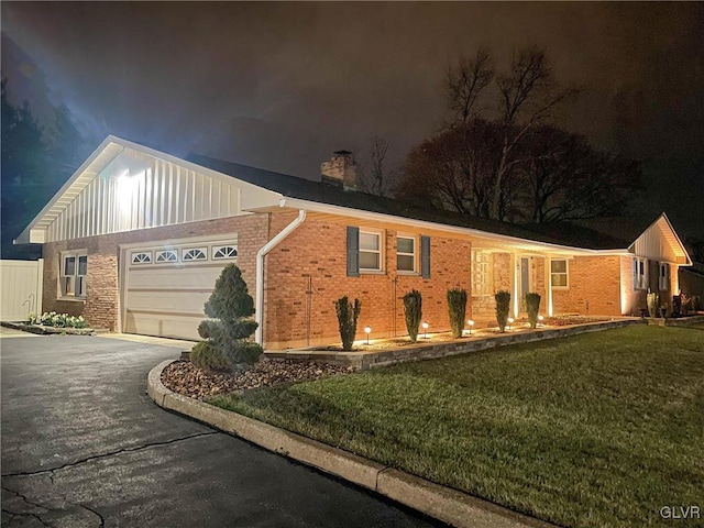 3332 Sherwood Rd, Palmer Twp, PA 18045 - ranch-style home with a garage, a yard, board and batten siding, and aphalt driveway