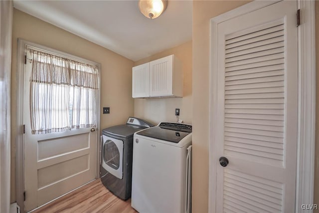 3332 Sherwood Rd, Palmer Twp, PA 18045 - laundry room featuring washer and dryer, cabinet space, and light wood-type flooring