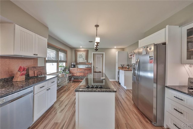 3332 Sherwood Rd, Palmer Twp, PA 18045 - kitchen with a center island, appliances with stainless steel finishes, white cabinetry, and light wood-style flooring