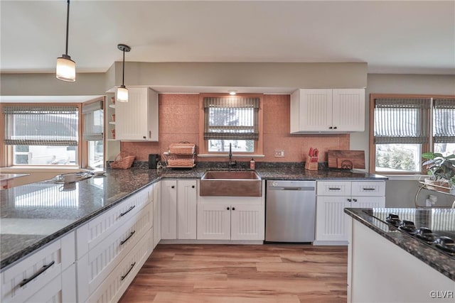 3332 Sherwood Rd, Palmer Twp, PA 18045 - kitchen with stainless steel dishwasher, a sink, white cabinets, light wood-type flooring, and backsplash
