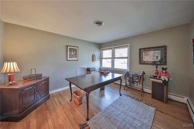 3332 Sherwood Rd, Palmer Twp, PA 18045 - office with a baseboard heating unit, baseboards, light wood-style floors, and visible vents