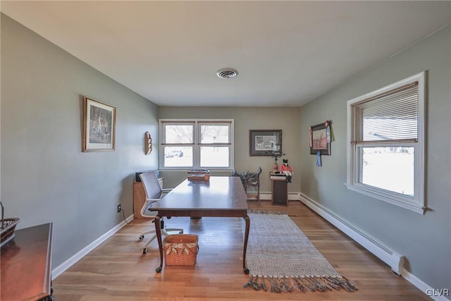 3332 Sherwood Rd, Palmer Twp, PA 18045 - office space with a baseboard radiator, baseboards, wood finished floors, and visible vents