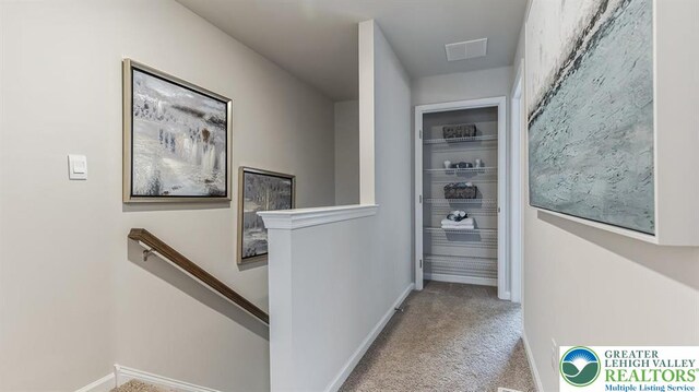 1207 Susan Cir, Upper Macungie Twp, PA 18031 - hallway with baseboards, visible vents, an upstairs landing, and carpet flooring