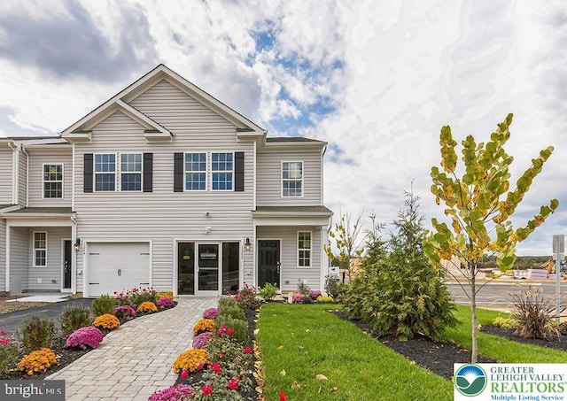 1205 Susan Cir, Upper Macungie Twp, PA 18031 - view of front of home with a garage, a front lawn, and decorative driveway