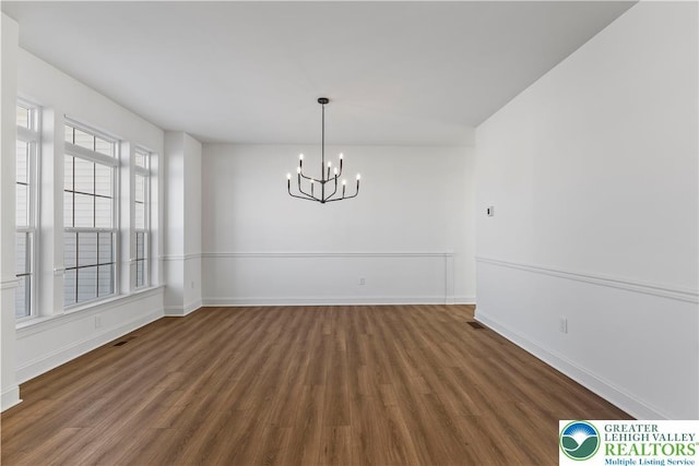 4450 Maple St Unit 2, North Whitehall Twp, PA 18078 - unfurnished dining area with a chandelier, wood finished floors, and baseboards
