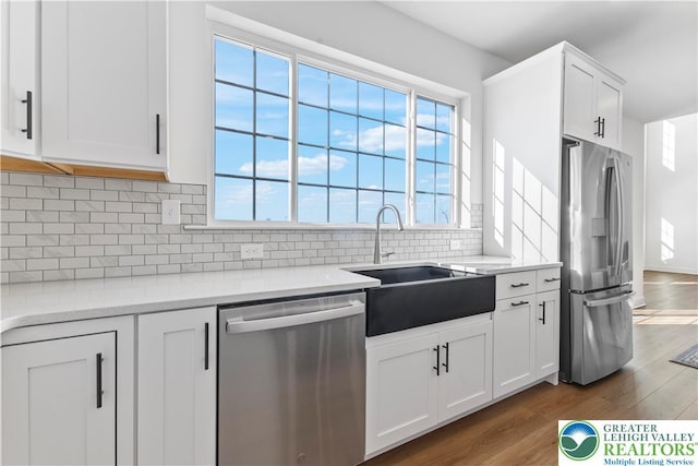 4450 Maple St Unit 2, North Whitehall Twp, PA 18078 - kitchen with stainless steel appliances, a sink, dark wood-style flooring, and white cabinetry