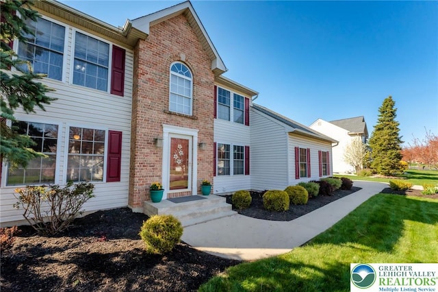 5931 Chapmans Rd, Upper Macungie Twp, PA 18069 - view of front facade with a front lawn and brick siding