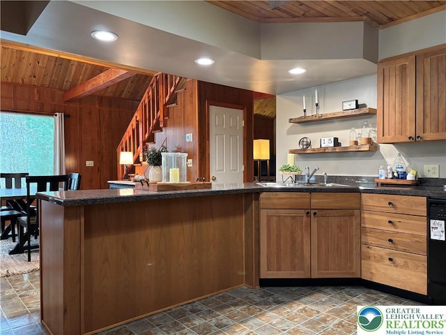 kitchen featuring wood walls, open shelves, beamed ceiling, stone finish floor, and wooden ceiling