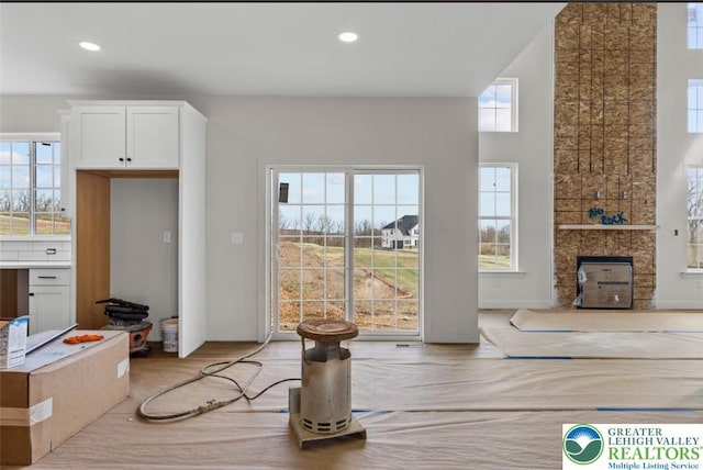 dining area with recessed lighting, plenty of natural light, and light wood finished floors
