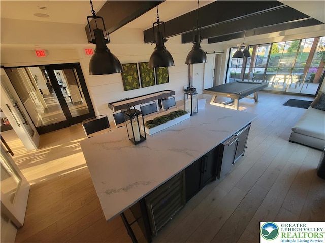 interior space featuring wood-type flooring, pool table, and plenty of natural light