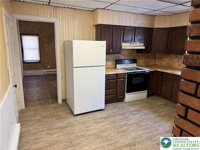 kitchen with a baseboard radiator, light countertops, electric range, under cabinet range hood, and freestanding refrigerator