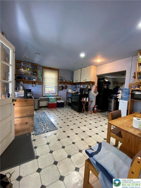 living area featuring light floors
