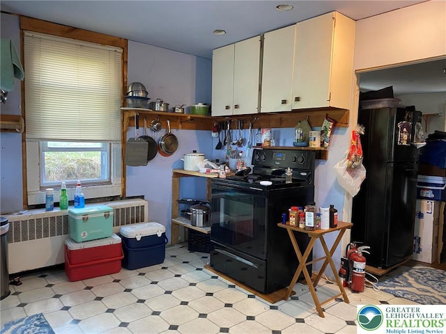 kitchen featuring light floors, black appliances, open shelves, and white cabinets