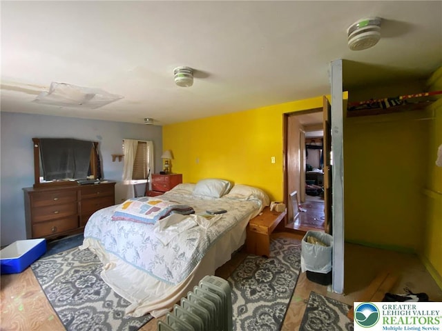 bedroom with radiator heating unit
