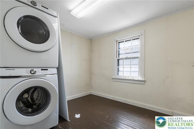 1226 Ferry St, Easton, PA 18042 - clothes washing area with stacked washer and clothes dryer, laundry area, dark wood-type flooring, crown molding, and baseboards