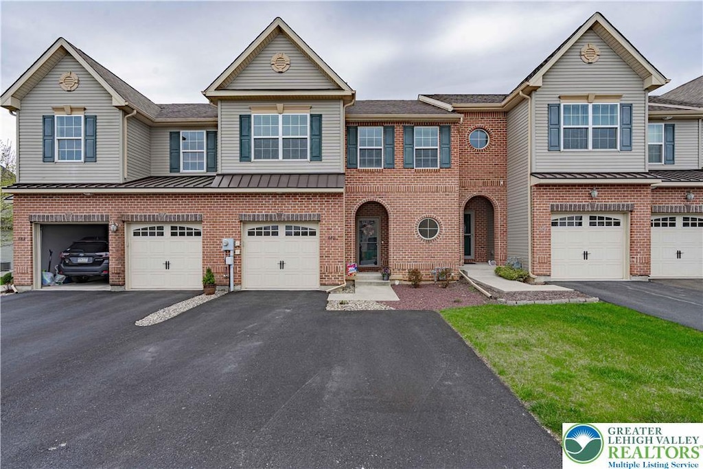 680 Mulberry Dr, Lower Nazareth Twp, PA 18064 - multi unit property with a standing seam roof, driveway, and an attached garage