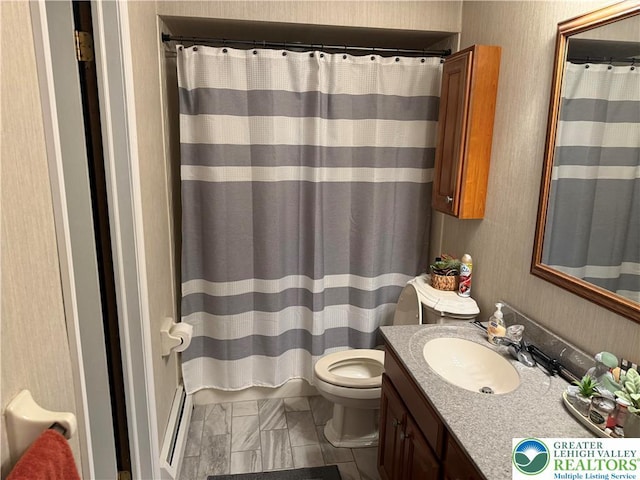 bathroom with toilet, curtained shower, vanity, and baseboard heating